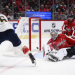 
              Florida Panthers center Colin White (6) scores against Washington Capitals goaltender Darcy Kuemper (35) during the second period of an NHL hockey game Thursday, Feb. 16, 2023, in Washington. Capitals left wing Marcus Johansson is at right rear. (AP Photo/Nick Wass)
            