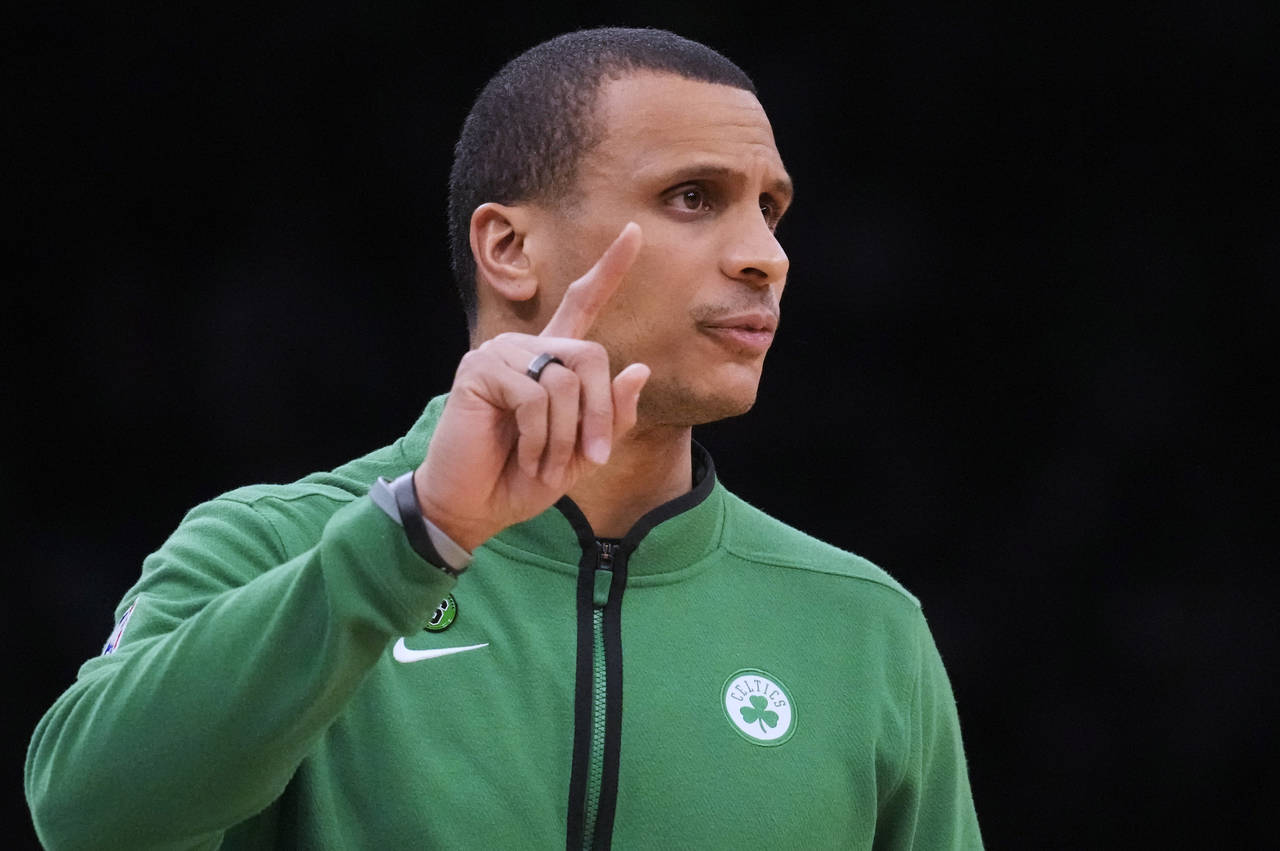 Boston Celtics interim head coach Joe Mazzulla calls to his players during the first half of an NBA...
