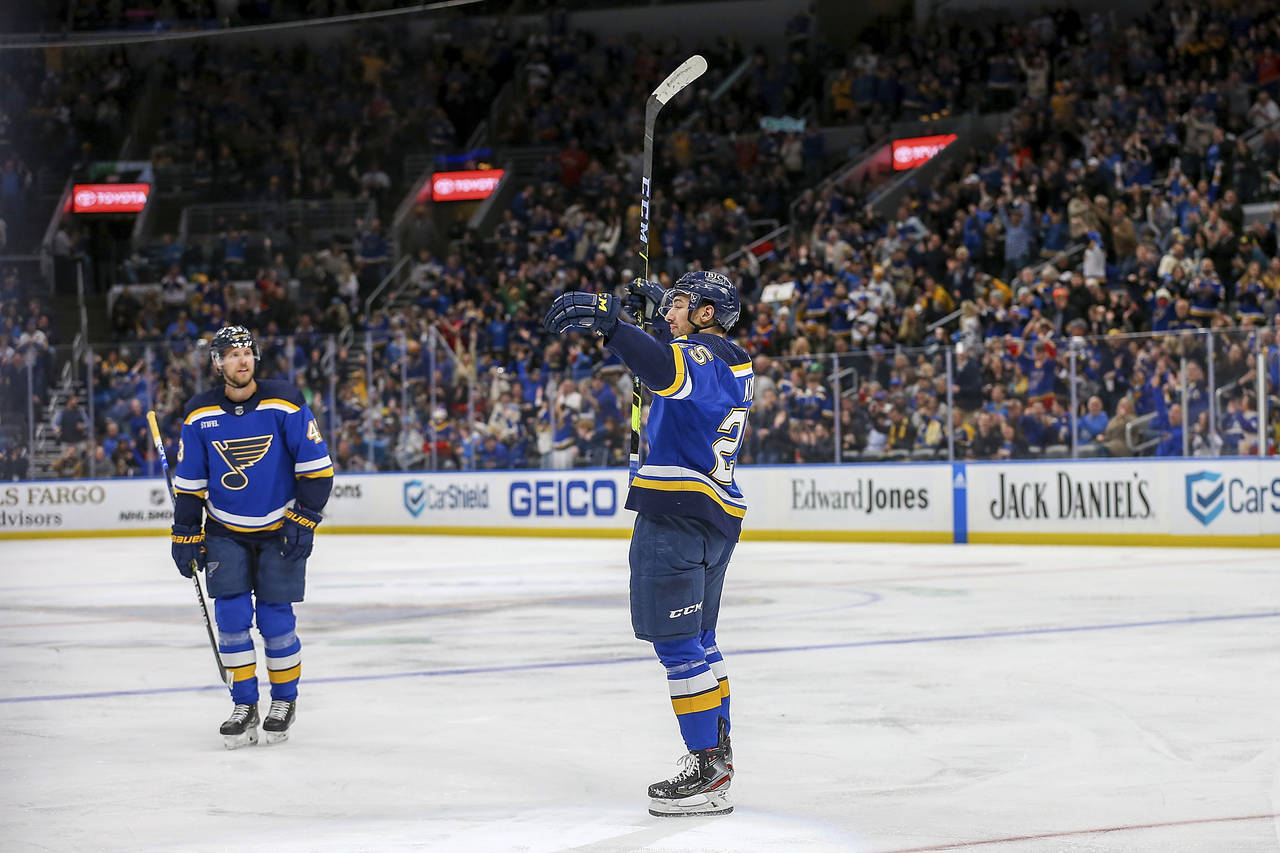 St. Louis Blues' Jordan Kyrou (25) reacts after scoring a goal against the New Jersey Devils during...