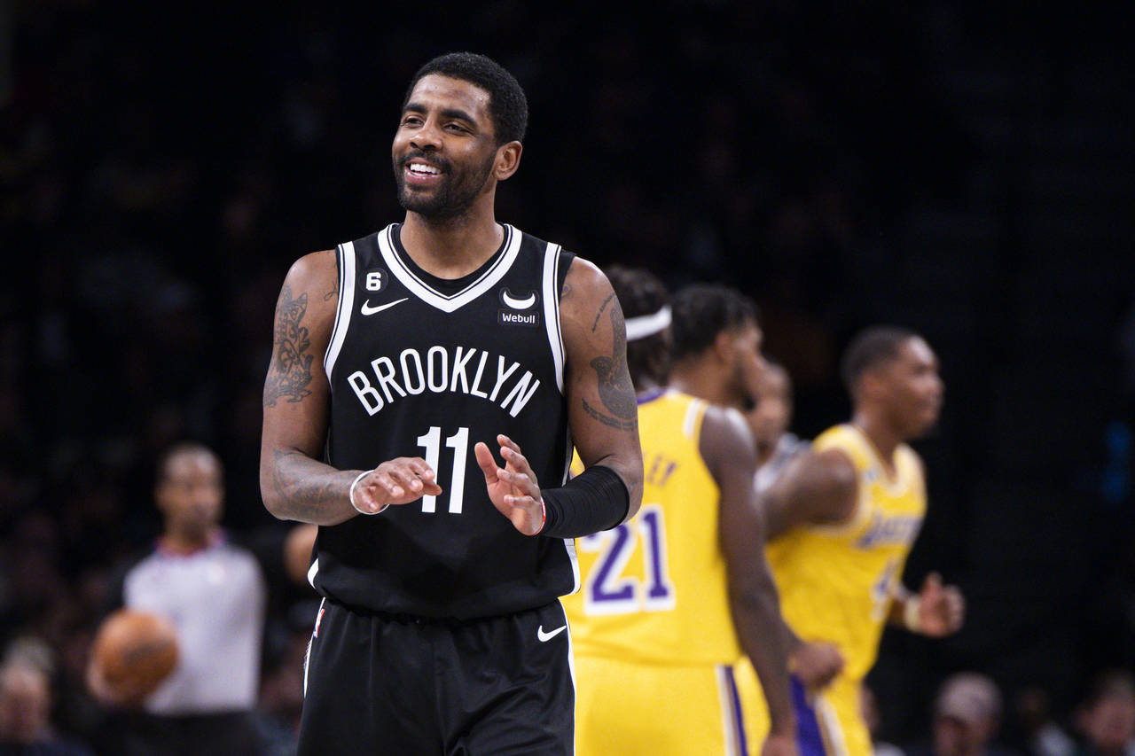 Brooklyn Nets guard Kyrie Irving (11) reacts during the second half of an NBA basketball game again...