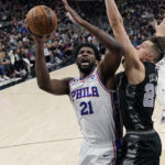 
              Philadelphia 76ers center Joel Embiid (21) is fouled as he drives to the basket against San Antonio Spurs forward Zach Collins (23) during the first half of an NBA basketball game in San Antonio, Friday, Feb. 3, 2023. (AP Photo/Eric Gay)
            