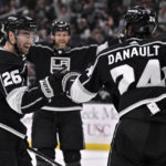 
              Los Angeles Kings defenseman Sean Walker, left, celebrates scoring a goal with center Phillip Danault during the second period of an NHL hockey game against the Buffalo Sabres in Los Angeles, Monday, Feb. 13, 2023. (AP Photo/Alex Gallardo)
            
