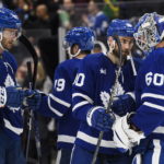 
              Toronto Maple Leafs forward Ryan O'Reilly (90) celebrates with goaltender Joseph Woll (60) and other teammates after they defeated the Montreal Canadiens in NHL hockey game action in Toronto, Saturday, Feb. 18, 2023. (Christopher Katsarov/The Canadian Press via AP)
            
