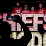 
              People have their photo taken with signage for the Kansas City Chiefs NFL football team while visiting a display Thursday, Feb. 9, 2023, at Union Station in Kansas City, Mo. The Chiefs are scheduled to play the Philadelphia Eagles in Super Bowl LVII on Sunday, Feb. 12, 2023. (AP Photo/Charlie Riedel)
            