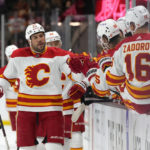 
              Calgary Flames left wing Milan Lucic celebrates with teammates after scoring a goal against the Arizona Coyotes in the first period during an NHL hockey game, Wednesday, Feb. 22, 2023, in Tempe, Ariz. (AP Photo/Rick Scuteri)
            