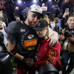 
              Kansas City Chiefs tight end Travis Kelce (87) hugs his mother Donna, after the NFL Super Bowl 57 football game, Sunday, Feb. 12, 2023, in Glendale, Ariz. The Chiefs defeated the Philadelphia Eagles 38-35. (AP Photo/Matt Slocum)
            