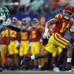 ARLINGTON, TEXAS - JANUARY 02: Raleek Brown #14 of the USC Trojans scores a touchdown against the Tulane Green Wave in the second quarter of the Goodyear Cotton Bowl Classic on January 02, 2023 at AT&T Stadium in Arlington, Texas. (Photo by Tom Pennington/Getty Images)