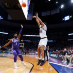 DENVER, COLORADO - MARCH 19: Rasir Bolton #45 of the Gonzaga Bulldogs shoots a three point basket over Mike Miles Jr. #1 of the TCU Horned Frogs during the second half in the second round of the NCAA Men's Basketball Tournament at Ball Arena on March 19, 2023 in Denver, Colorado. (Photo by Justin Edmonds/Getty Images)