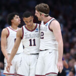 DENVER, COLORADO - MARCH 19: Drew Timme #2 and Nolan Hickman #11 of the Gonzaga Bulldogs talk during the second half against the TCU Horned Frogs in the second round of the NCAA Men's Basketball Tournament at Ball Arena on March 19, 2023 in Denver, Colorado. (Photo by Sean M. Haffey/Getty Images)