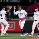 SEATTLE, WASHINGTON - MARCH 30: Julio Rodriguez #44 of the Seattle Mariners celebrates with teammates after beating the Cleveland Guardians during Opening Day at T-Mobile Park on March 30, 2023 in Seattle, Washington. (Photo by Steph Chambers/Getty Images)