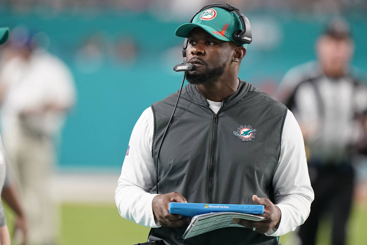 FILE - Miami Dolphins head coach Brian Flores stands on the sideline during the second half of an N...