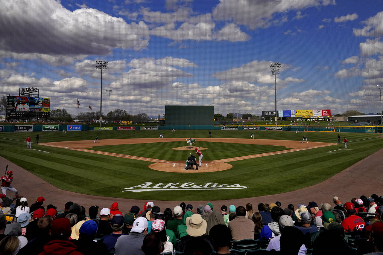 The Los Angeles Angels and the Oakland Athletics compete during the fourth inning of a spring train...