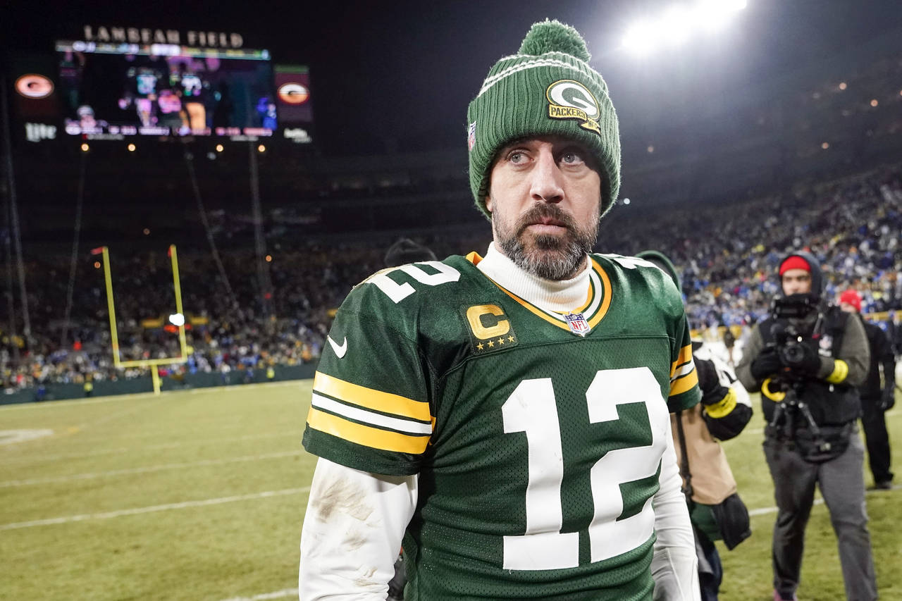 FILE - Green Bay Packers' Aaron Rodgers walks off the field after an NFL football game against the ...