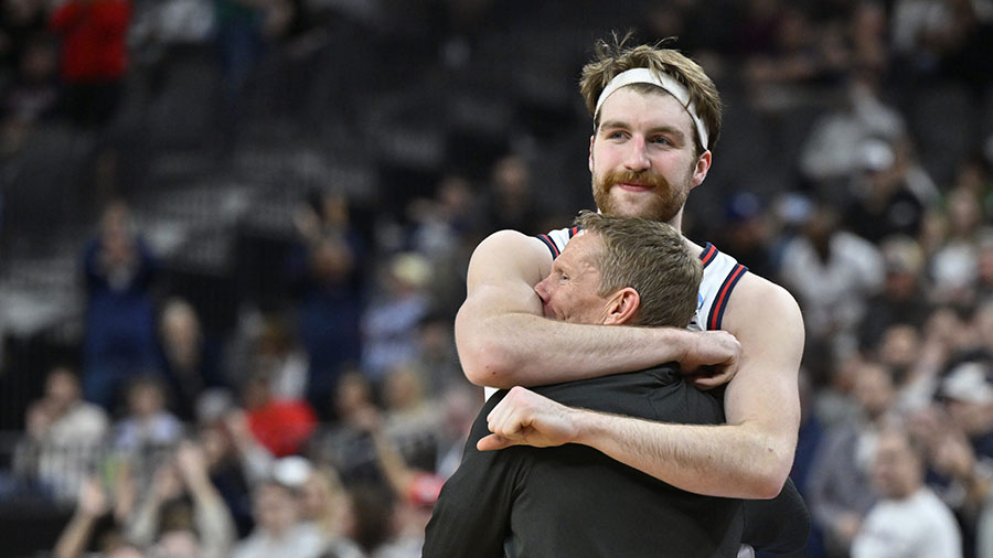 Gonzaga forward Drew Timme hugs coach Mark Few during the final minutes of a March 25, 2023 game. (...