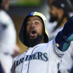 Seattle Mariners' Teoscar Hernandez celebrates his home run against the St. Louis Cardinals with a helmet and trident in the dugout during the fourth inning of a baseball game Friday, April 21, 2023, in Seattle. (AP Photo/Caean Couto)Credit: ASSOCIATED PRESS