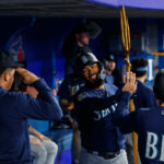 TORONTO, ON - APRIL 30: Teoscar Hernandez #35 of the Seattle Mariners celebrates a solo home-run in the dugout during the sixth inning of their MLB game against the Toronto Blue Jays at Rogers Centre on April 30, 2023 in Toronto, Canada. (Photo by Cole Burston/Getty Images)