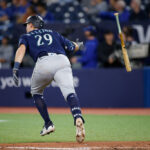 TORONTO, ON - APRIL 30: Cal Raleigh #29 of the Seattle Mariners tosses the bat as he hits a two-run home-run during the tenth inning of their MLB game against the Toronto Blue Jays at Rogers Centre on April 30, 2023 in Toronto, Canada. (Photo by Cole Burston/Getty Images)