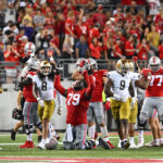 COLUMBUS, OHIO - SEPTEMBER 03: Dawand Jones #79 of the Ohio State Buckeyes falls to his knees in celebration after defeating the Notre Dame Fighting Irish 21-10 in a game at Ohio Stadium on September 03, 2022 in Columbus, Ohio. (Photo by Ben Jackson/Getty Images)