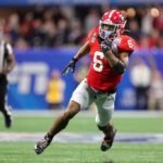 ATLANTA, GEORGIA - DECEMBER 31: Kenny McIntosh #6 of the Georgia Bulldogs rushes during the second quarter against the Ohio State Buckeyes in the Chick-fil-A Peach Bowl at Mercedes-Benz Stadium on December 31, 2022 in Atlanta, Georgia. (Photo by Carmen Mandato/Getty Images)