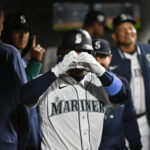 SEATTLE, WASHINGTON - APRIL 15: Eugenio Suarez #42 of the Seattle Mariners gestures after hitting a home run during the fourth inning of the game against the Colorado Rockies at T-Mobile Park on April 15, 2023 in Seattle, Washington. All players are wearing the number 42 in honor of Jackie Robinson Day. (Photo by Alika Jenner/Getty Images)