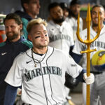 SEATTLE, WASHINGTON - APRIL 22: Jarred Kelenic #10 of the Seattle Mariners celebrates with teammates after hitting a home run during the second inning against the St. Louis Cardinals at T-Mobile Park on April 22, 2023 in Seattle, Washington. (Photo by Alika Jenner/Getty Images)