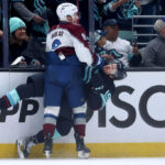 SEATTLE, WASHINGTON - APRIL 24: Cale Makar #8 of the Colorado Avalanche checks Jared McCann #19 of the Seattle Kraken during the first period in Game Four of the First Round of the 2023 Stanley Cup Playoffs at Climate Pledge Arena on April 24, 2023 in Seattle, Washington. (Photo by Steph Chambers/Getty Images)