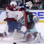 SEATTLE, WASHINGTON - APRIL 24: Matt Nieto #83 of the Colorado Avalanche collides with Philipp Grubauer #31 of the Seattle Kraken during the third period in Game Four of the First Round of the 2023 Stanley Cup Playoffs at Climate Pledge Arena on April 24, 2023 in Seattle, Washington. (Photo by Steph Chambers/Getty Images)