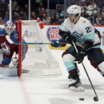 DENVER, COLORADO - APRIL 26: Alex Wennberg #21 of the Seattle Kraken looks for an opening against the Colorado Avalanche in the first period during Game Five of the First Round of the 2023 Stanley Cup Playoffs at Ball Arena on April 26, 2023 in Denver, Colorado. (Photo by Matthew Stockman/Getty Images)