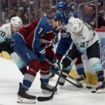 DENVER, COLORADO - APRIL 26: Yanni Gourde #37 of the Seattle Kraken fights for control of the puck against Devon Toews #7 and Samuel Girard #49 of the Colorado Avalanche in the first period during Game Five of the First Round of the 2023 Stanley Cup Playoffs at Ball Arena on April 26, 2023 in Denver, Colorado. (Photo by Matthew Stockman/Getty Images)