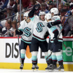 DENVER, COLORADO - APRIL 26: Tye Kartye #52 of the Seattle Kraken celebrates with Matty Beniers #10, Will Borgen #3, and Jordan Eberle 7 after scoring against the Colorado Avalanche in the second period during Game Five of the First Round of the 2023 Stanley Cup Playoffs at Ball Arena on April 26, 2023 in Denver, Colorado. (Photo by Matthew Stockman/Getty Images)