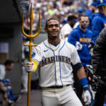 SEATTLE, WA - MAY 07: Julio Rodriguez #44 of the Seattle Mariners poses with a trident in the dugout after hitting a solo home run against the Houston Astros during the second inning at T-Mobile Park on May 7, 2023 in Seattle, Washington. (Photo by Stephen Brashear/Getty Images)