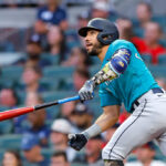 ATLANTA, GA - MAY 20: Jose Caballero #76 of the Seattle Mariners hits a sacrifice fly during the fourth inning against the Atlanta Braves at Truist Park on May 20, 2023 in Atlanta, Georgia. (Photo by Todd Kirkland/Getty Images)