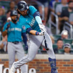 ATLANTA, GA - MAY 20: Eugenio Suarez #28 of the Seattle Mariners hits a two-run home run during the seventh inning against the Atlanta Braves at Truist Park on May 20, 2023 in Atlanta, Georgia. (Photo by Todd Kirkland/Getty Images)