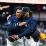 SEATTLE, WA - MAY 22: Starting pitcher Luis Castillo #58 of the Seattle Mariners (L) gets a hug after registering his 1,000th career strike out from third baseman Eugenio Suarez #28 in the fifth inning at T-Mobile Park on May 22, 2023 in Seattle, Washington. (Photo by Stephen Brashear/Getty Images)