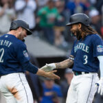 SEATTLE, WA - MAY 23: J.P. Crawford #3 of the Seattle Mariners is congratulated by Tom Murphy #2 after hitting a two-run home run off of Luis Medina #46 of the Oakland Athletics that also scored Murphy during the fifth inning of a game at T-Mobile Park on May 23, 2023 in Seattle, Washington. (Photo by Stephen Brashear/Getty Images)