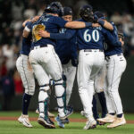 SEATTLE, WA - MAY 24:  (L-R) Cal Raleigh #29 of the Seattle Mariners, Tayler Saucedo #60, J.P. Crawford #3, and Sam Haggerty #0 celebrate after a 6-1 victory against the Oakland Athletics at T-Mobile Park on May 24, 2023 in Seattle, Washington. (Photo by Stephen Brashear/Getty Images)