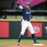 SEATTLE, WA - MAY 25: Julio Rodriguez #44 of the Seattle Mariners celebrates after hitting a double off relief pitcher Garrett Acton #67 of the Oakland Athletics during the eighth inning of a game at T-Mobile Park on May 25, 2023 in Seattle, Washington. (Photo by Stephen Brashear/Getty Images)