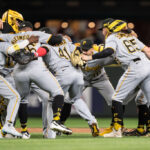 SEATTLE, WA - MAY 26: From left, Andrew McCutchen #22 of the Pittsburgh Pirates, Duane Underwood Jr. #56, Carlos Santana #41, Bryan Reynolds #10 and Jack Suwinski celebrate after a game against the Seattle Mariners at T-Mobile Park on May 26, 2023 in Seattle, Washington. The Pirates won 11-6. (Photo by Stephen Brashear/Getty Images)