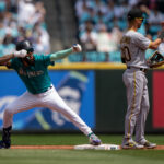 SEATTLE, WA - MAY 27: J.P. Crawford #3, left, of the Seattle Mariners celebrates after hitting a double off starting pitcher  Vince Velasquez #27 of the Pittsburgh Pirates during the first inning at T-Mobile Park on May 27, 2023 in Seattle, Washington. (Photo by Stephen Brashear/Getty Images)