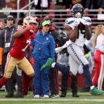 SANTA CLARA, CALIFORNIA - JANUARY 14: DK Metcalf #14 of the Seattle Seahawks catches a 50 yard pass to score a touchdown against the San Francisco 49ers during the second quarter in the NFC Wild Card playoff game at Levi's Stadium on January 14, 2023 in Santa Clara, California. (Photo by Ezra Shaw/Getty Images)