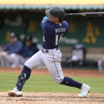 OAKLAND, CALIFORNIA - MAY 04: Kolten Wong #16 of the Seattle Mariners hits a bases loaded two-run rbi single against the Oakland Athletics in the top of the fourth inning at RingCentral Coliseum on May 04, 2023 in Oakland, California. (Photo by Thearon W. Henderson/Getty Images)