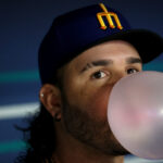 SEATTLE, WASHINGTON - MAY 05: Eugenio Suarez #28 of the Seattle Mariners blows a bubble before the game against the Houston Astros at T-Mobile Park on May 05, 2023 in Seattle, Washington. (Photo by Steph Chambers/Getty Images)