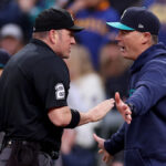 SEATTLE, WASHINGTON - MAY 06: Manager Scott Servais #9 of the Seattle Mariners challenges a play at home plate with umpire Dan Bellino #2 against the Houston Astros during the fifth inning lat T-Mobile Park on May 06, 2023 in Seattle, Washington. (Photo by Steph Chambers/Getty Images)