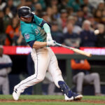 SEATTLE, WASHINGTON - MAY 06: Ty France #23 of the Seattle Mariners hits a single during the eighth inning against the Houston Astros at T-Mobile Park on May 06, 2023 in Seattle, Washington. (Photo by Steph Chambers/Getty Images)