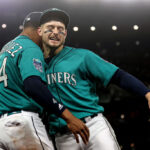 SEATTLE, WASHINGTON - MAY 06: Julio Rodriguez #44 and Jarred Kelenic #10 of the Seattle Mariners react during the ninth inning against the Houston Astros at T-Mobile Park on May 06, 2023 in Seattle, Washington. (Photo by Steph Chambers/Getty Images)
