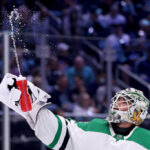SEATTLE, WASHINGTON - MAY 07: Jake Oettinger #29 of the Dallas Stars sprays water against the Seattle Kraken during the second period in Game Three of the Second Round of the 2023 Stanley Cup Playoffs at Climate Pledge Arena on May 07, 2023 in Seattle, Washington. (Photo by Steph Chambers/Getty Images)