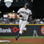 SEATTLE, WASHINGTON - MAY 09: Tom Murphy #2 of the Seattle Mariners rounds the bases after hitting a two-run home run during the seventh inning against the Texas Rangers at T-Mobile Park on May 09, 2023 in Seattle, Washington. (Photo by Alika Jenner/Getty Images)
