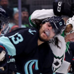 SEATTLE, WASHINGTON - MAY 13: Brandon Tanev #13 of the Seattle Kraken is checked by Joel Kiviranta #25 of the Dallas Stars during the first period in Game Six of the Second Round of the 2023 Stanley Cup Playoffs at Climate Pledge Arena on May 13, 2023 in Seattle, Washington. (Photo by Steph Chambers/Getty Images)