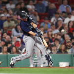 BOSTON, MASSACHUSETTS - MAY 15: Cal Raleigh #29 of the Seattle Mariners hits a two-run home run - his second of the game - during the sixth inning against the Boston Red Sox at Fenway Park on May 15, 2023 in Boston, Massachusetts. (Photo by Paul Rutherford/Getty Images)