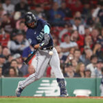 BOSTON, MASSACHUSETTS - MAY 15: Eugenio Suarez #28 of the Seattle Mariners hits a two-run home run in the eighth inning against the Boston Red Sox at Fenway Park on May 15, 2023 in Boston, Massachusetts. (Photo by Paul Rutherford/Getty Images)
